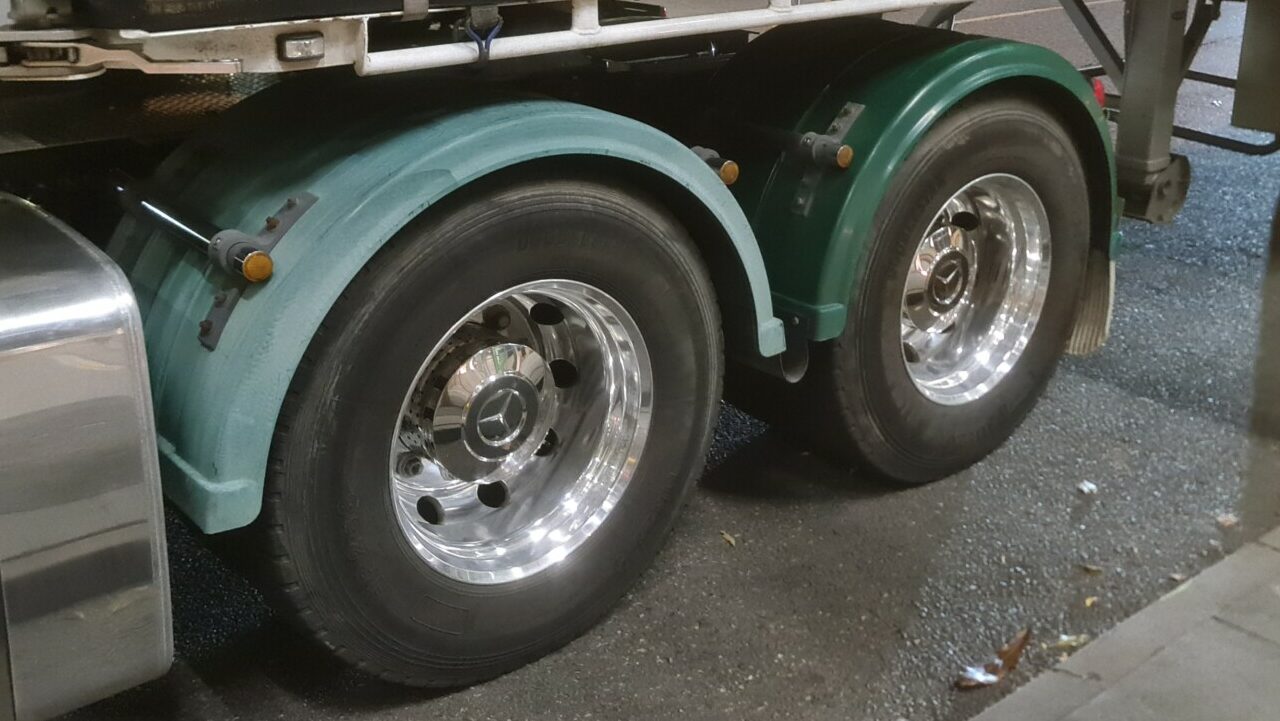 Popular competitor mudguard in Australia on a truck with one faded guards (left) and one new guard not yet faded (right)